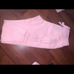 A kids 3 piece sweatsuit